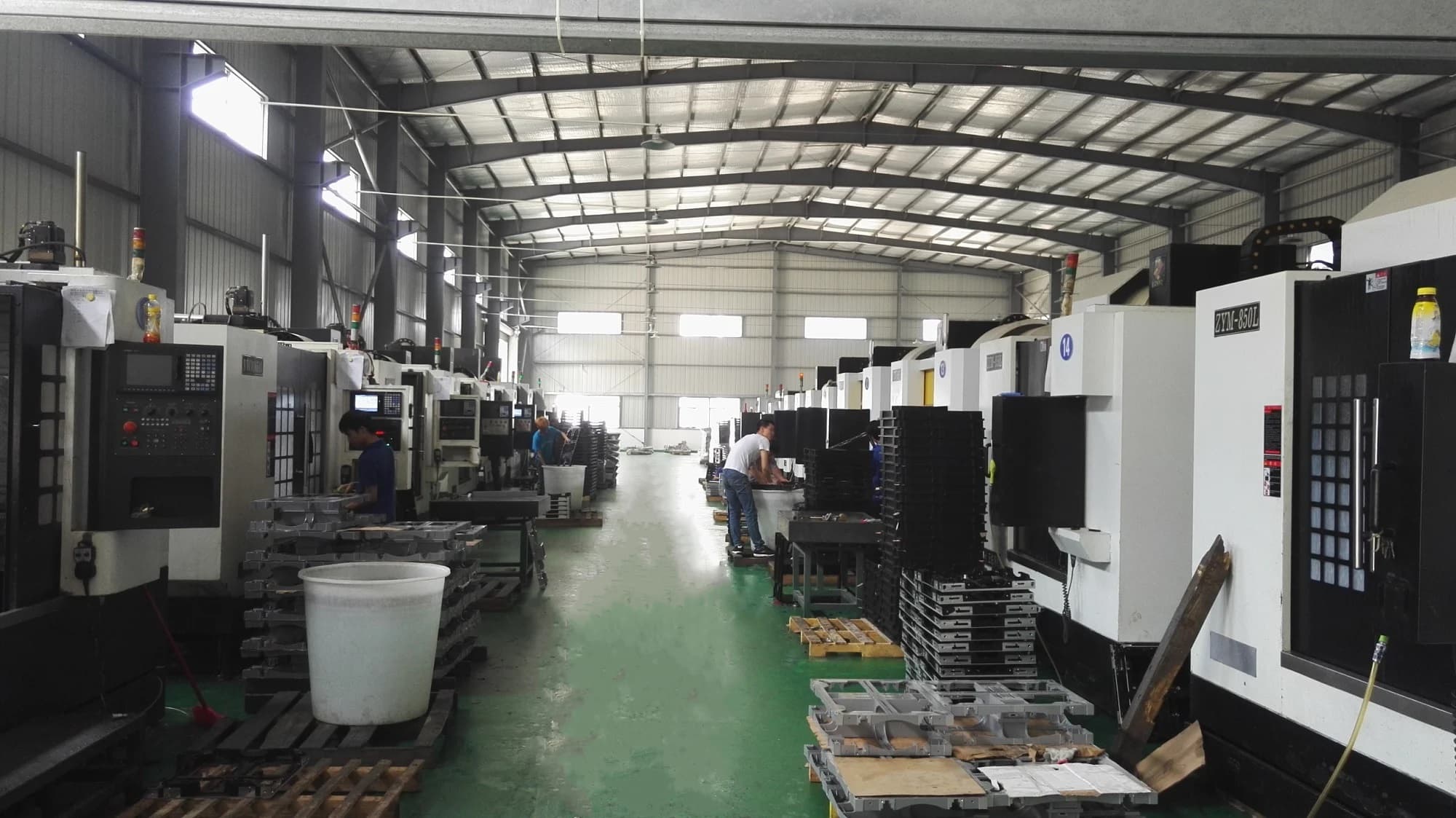 AIRMEGA factory floor with machining equipment and workers